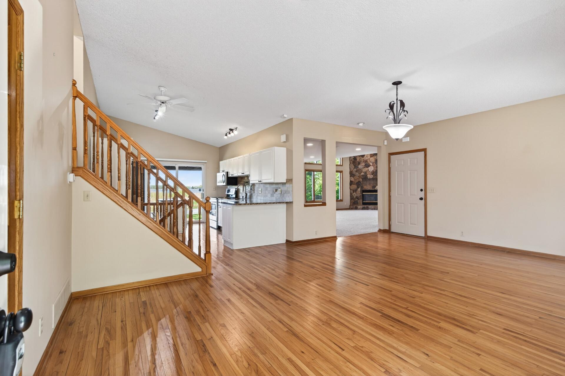 Upon entering the home you're greeted by gleaming hardwoord floors and the formal dining space.