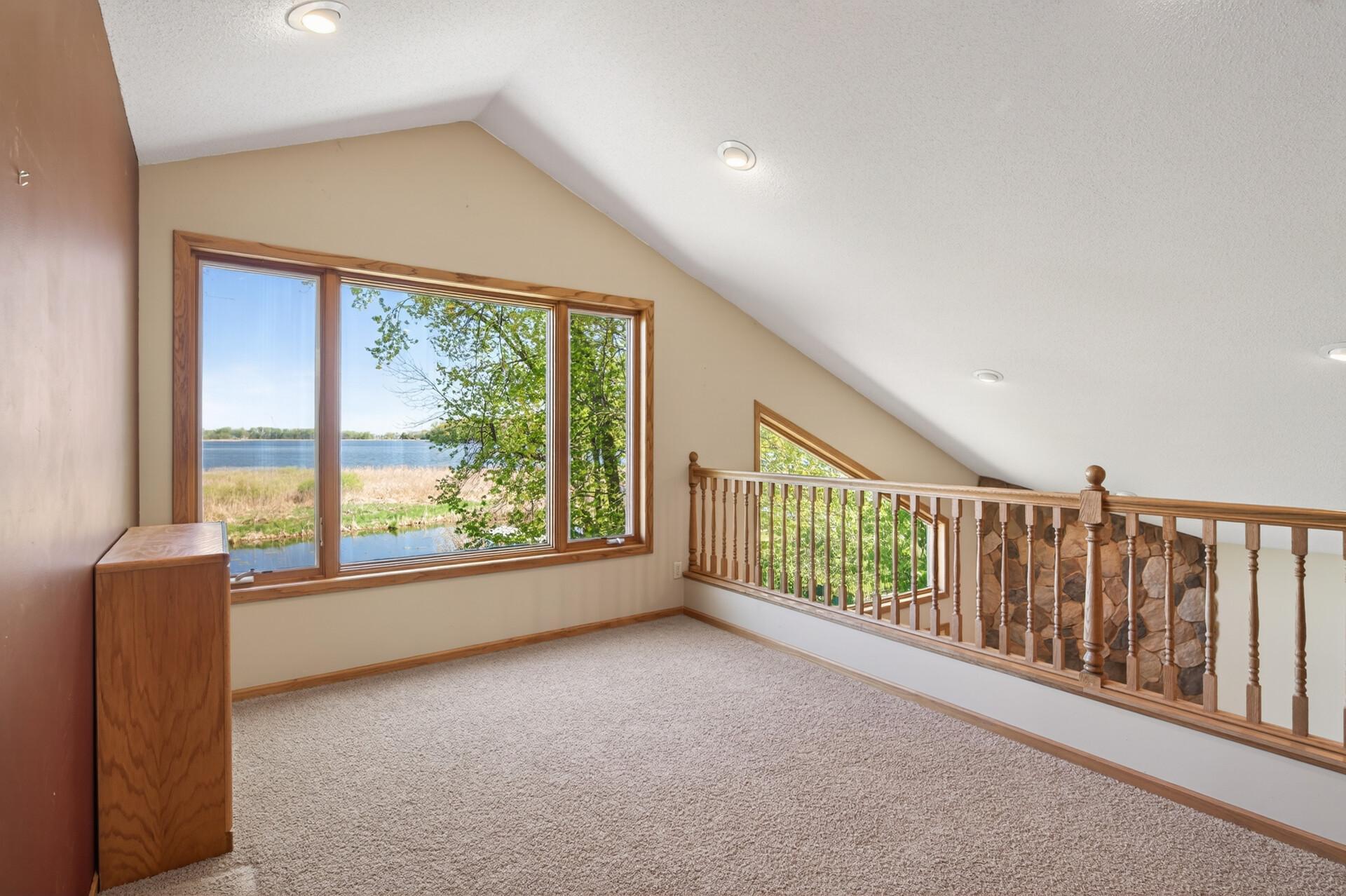 Loft in the addition - great space to set up your office when working from home and taking in the amazing view of Eagle Lake!