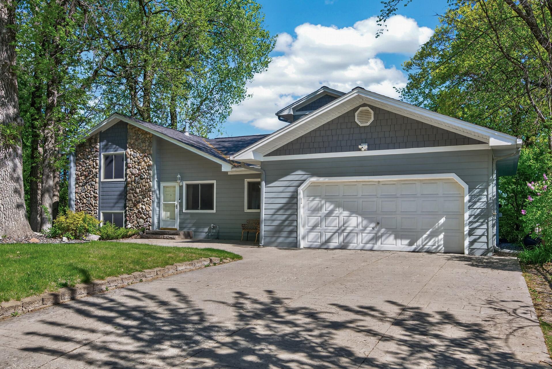 Great curb appeal with the Hardie Board siding, stone accents & stamped concrete driveway!