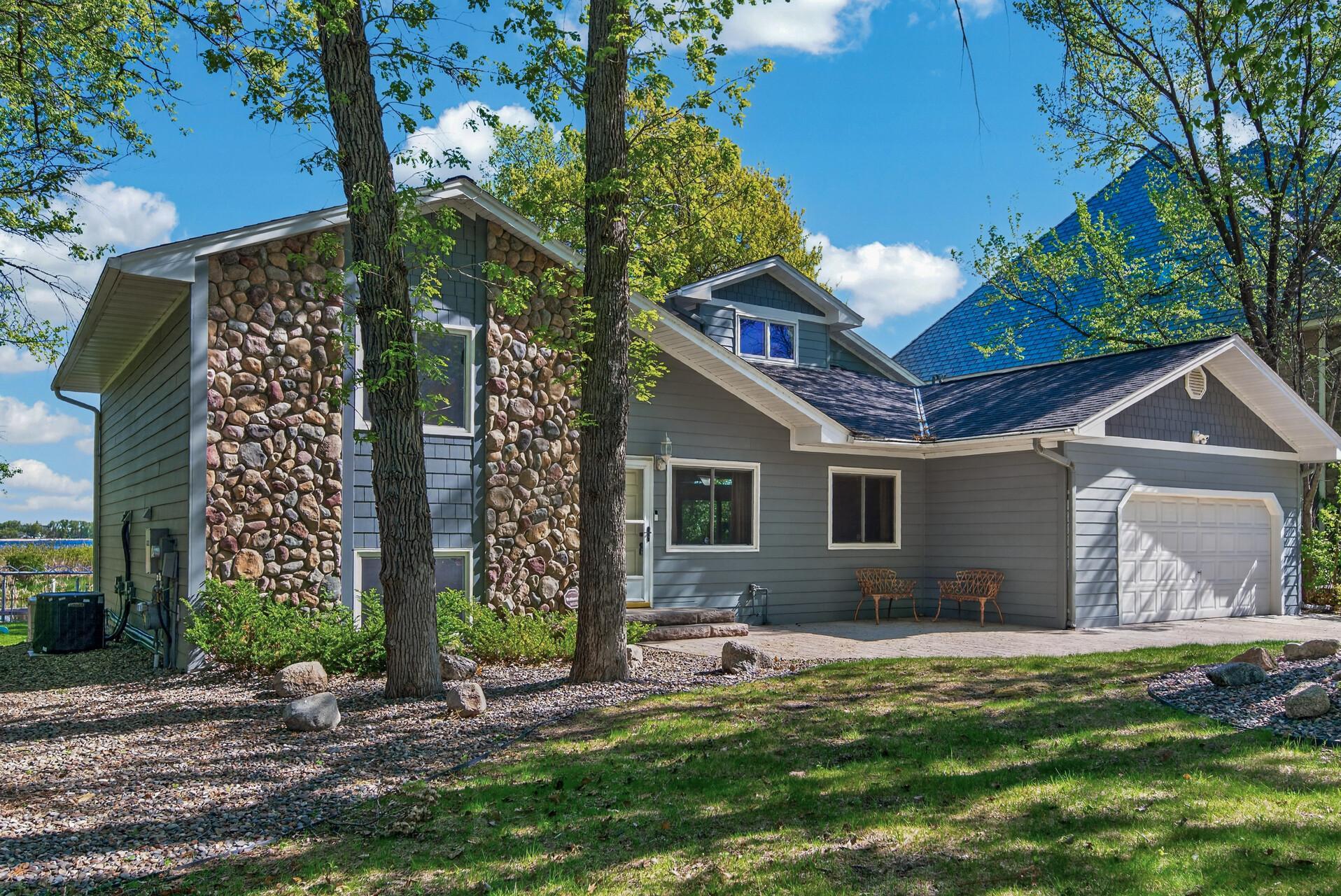 Great curb appeal with the Hardie Board siding, stone accents & stamped concrete driveway!