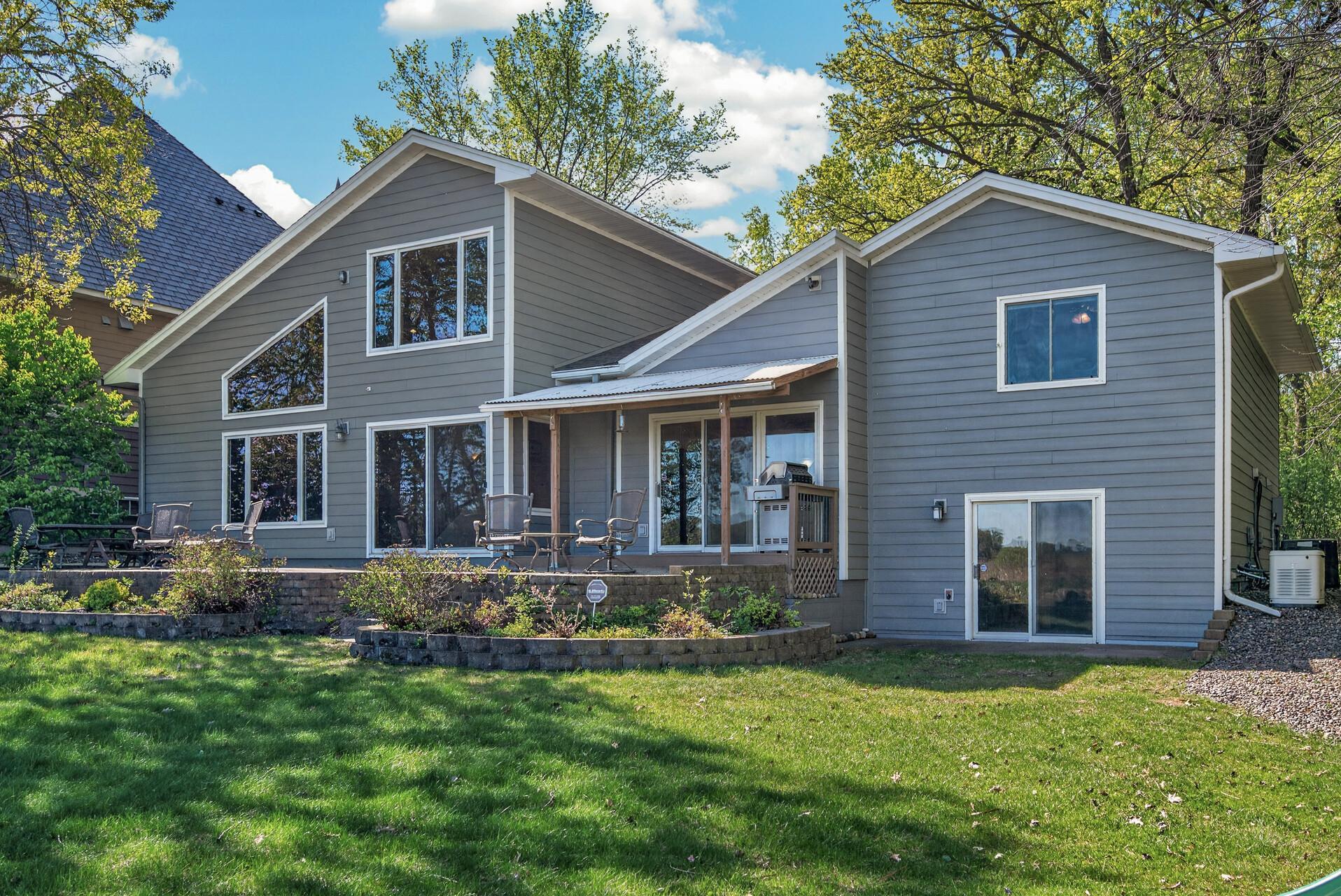 Huge patio in the back of the home for seating and taking in the private views and nature surrounding Eagle Lake!
