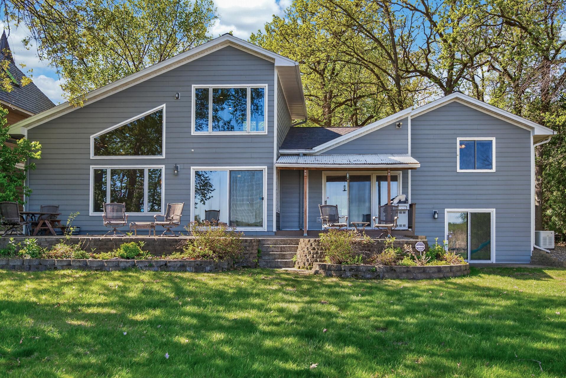 Huge patio in the back of the home for seating and taking in the private views and nature surrounding Eagle Lake!