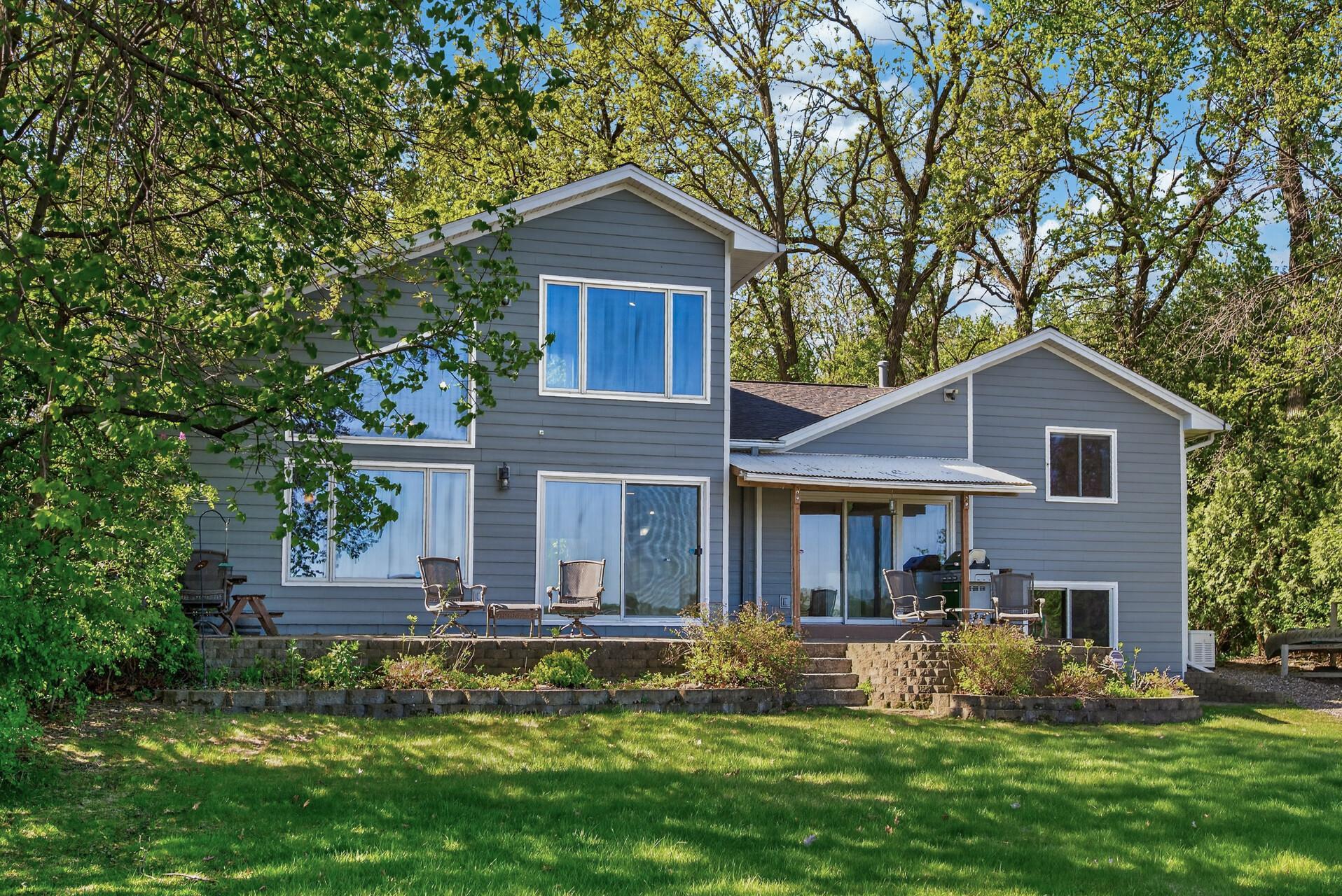 Huge patio in the back of the home for seating and taking in the private views and nature surrounding Eagle Lake!