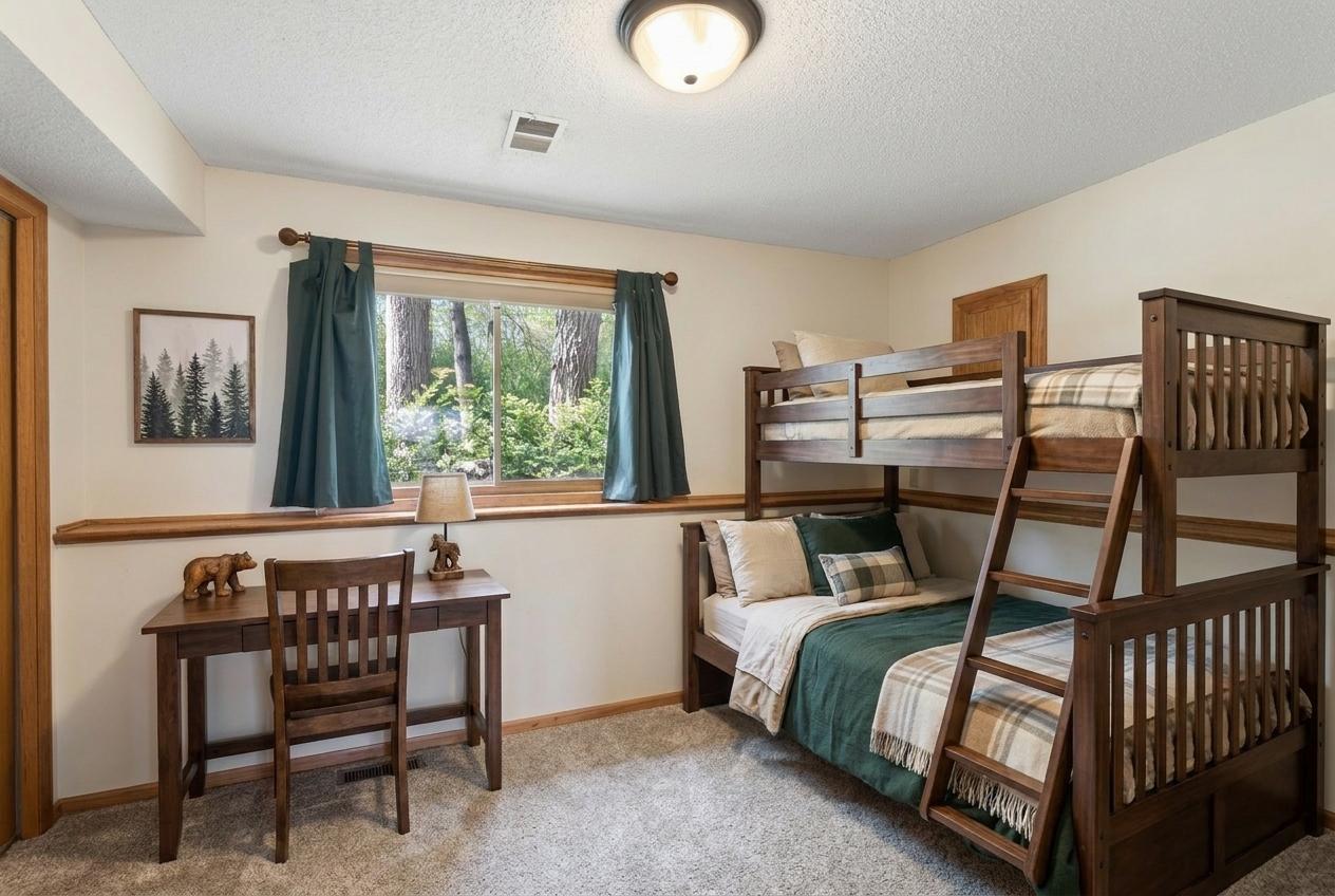 Virtually staged bedroom in the lower level.