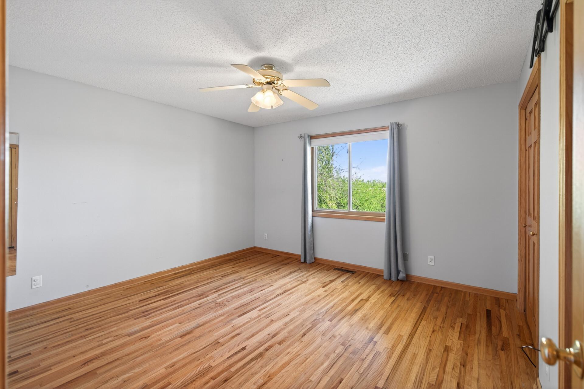 Primary bedroom on upper level. Has 2 closets and connects to the bathroom.