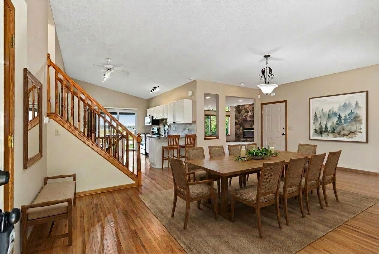 Virutally staged dining room and front entry.