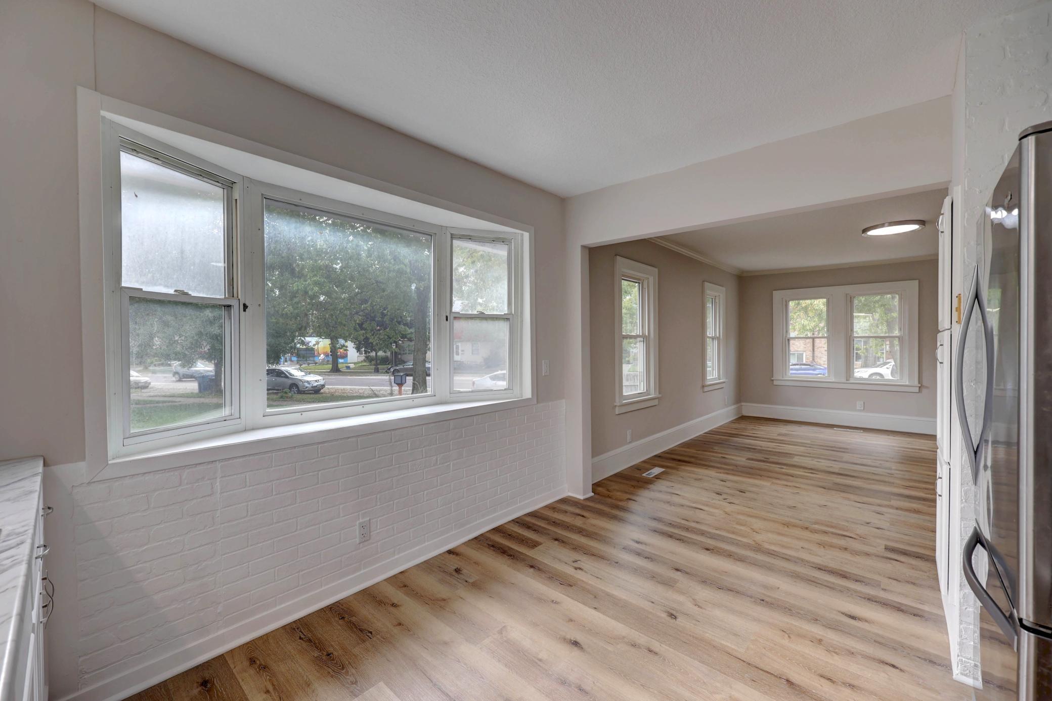 The New Vinyl Windows Open from Inside for Easier Cleaning. The Abundance of Windows and New Lighting helps Create a Bright and Sunny Ambiance! This Home is a House Plant Sanctuary!