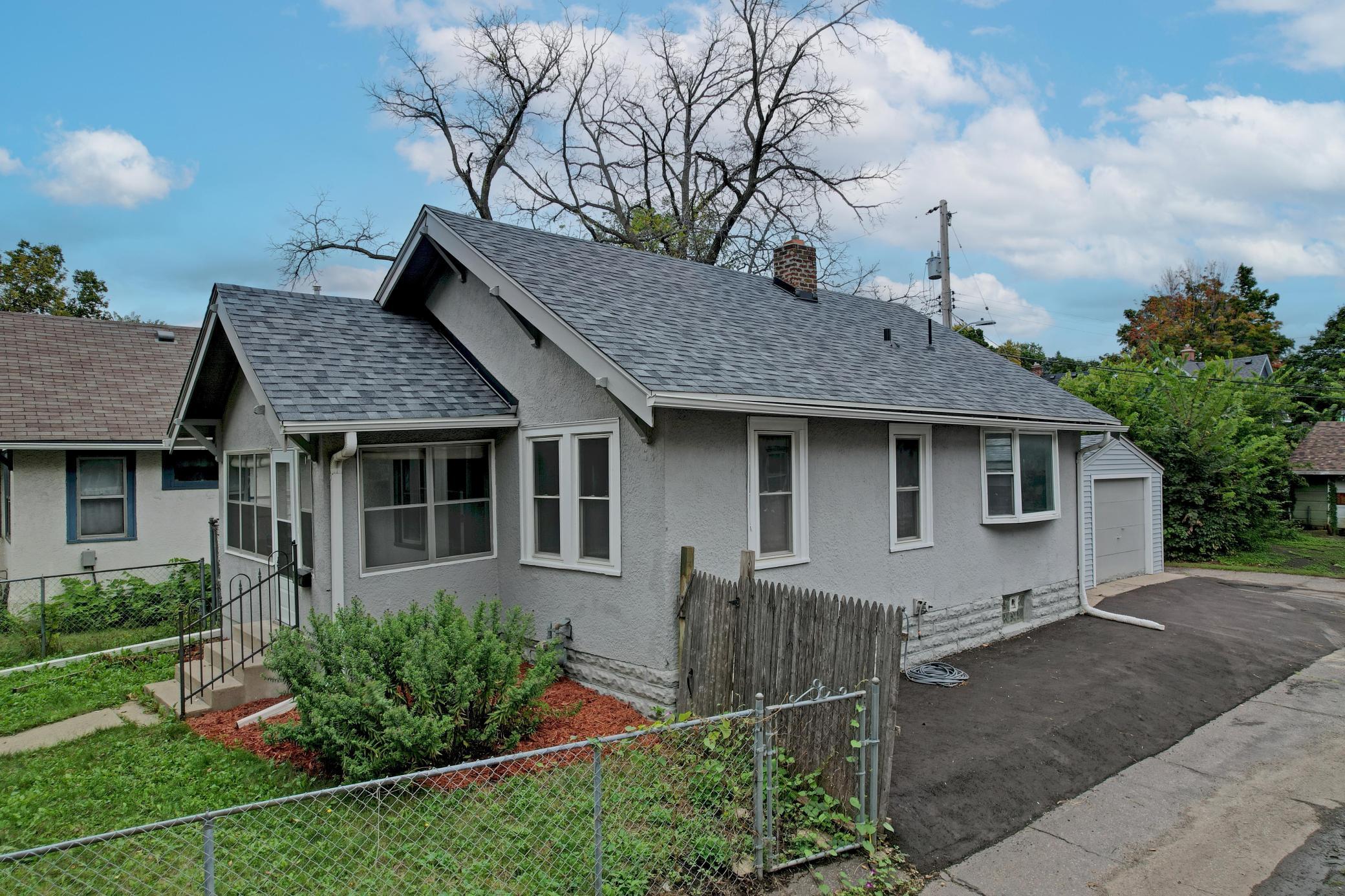 Brand New Asphalt allows for One or Two Off-Street Parking Spots. The Back Yard is Small, ready for Your Grill and just steps into the Garage!