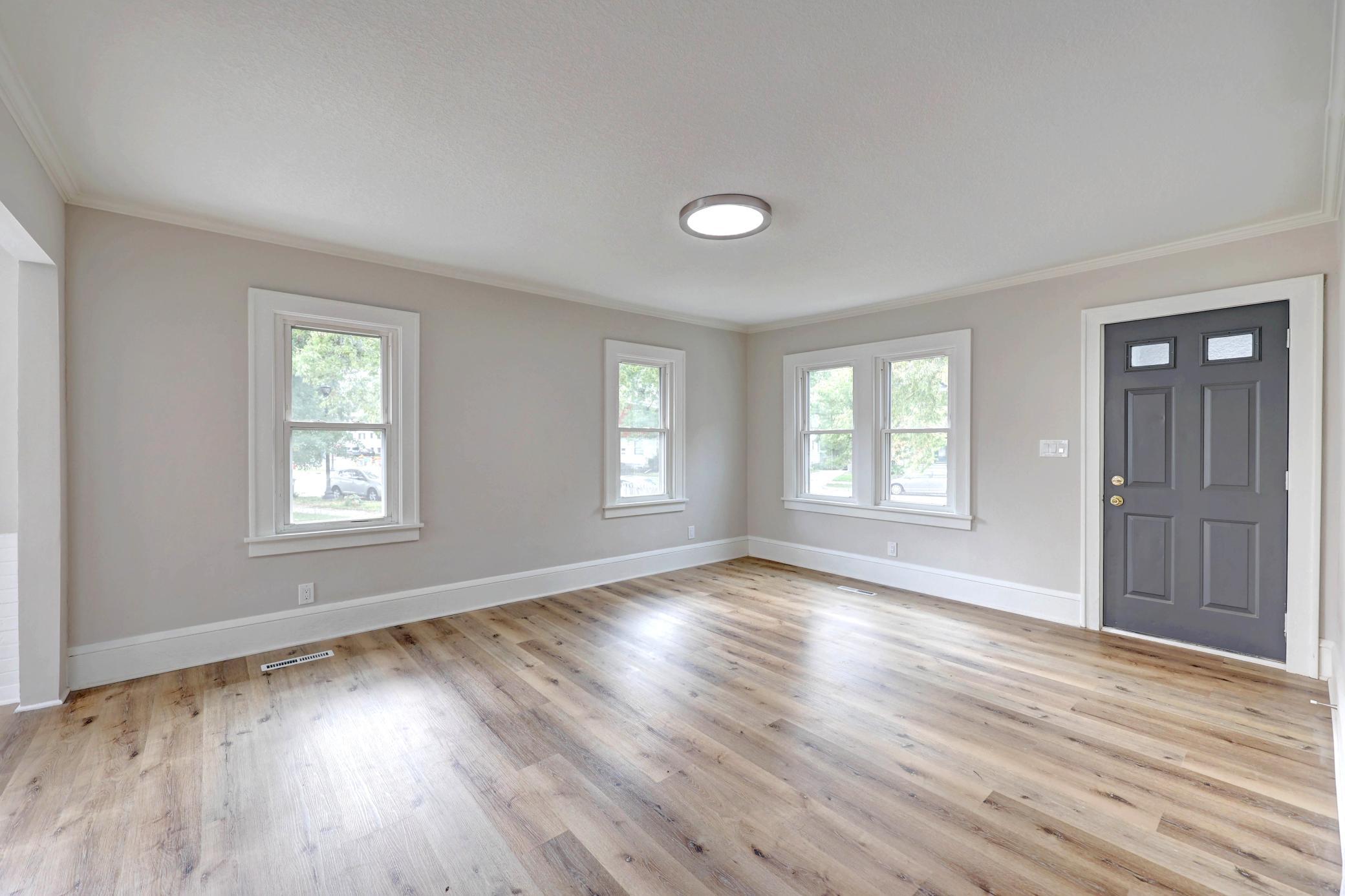 The New Flooring Shimmers from the SW Exposure. With the Front Porch, you don't have to worry about dirty shoes coming in the house.