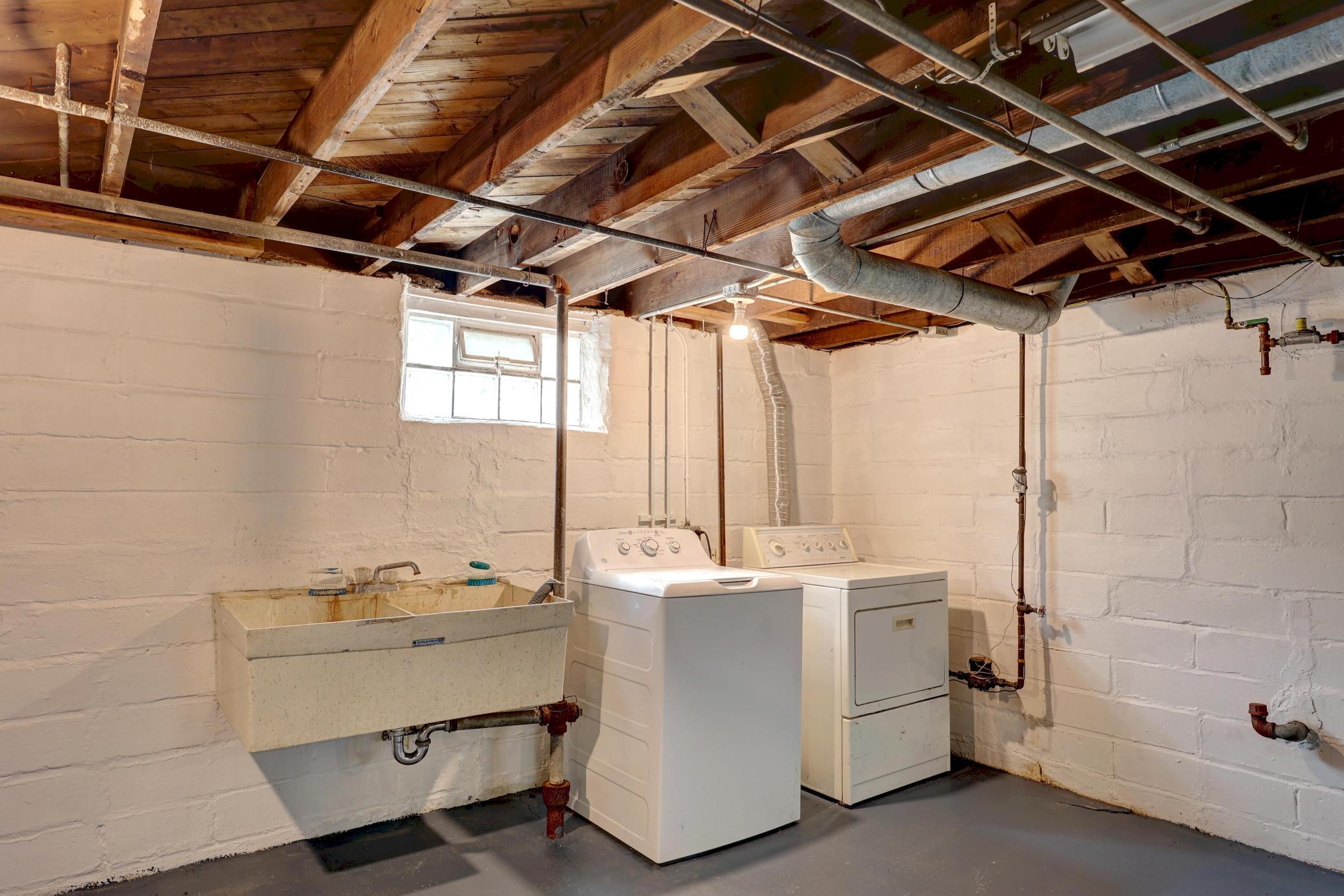 A Washer and Gas Dryer mean no more trips to the Laundromat! The Huge Laundry Tubs will be Appreciated for Washing the Dog or Household Clean-up! Glass Block Windows for Light and Security!