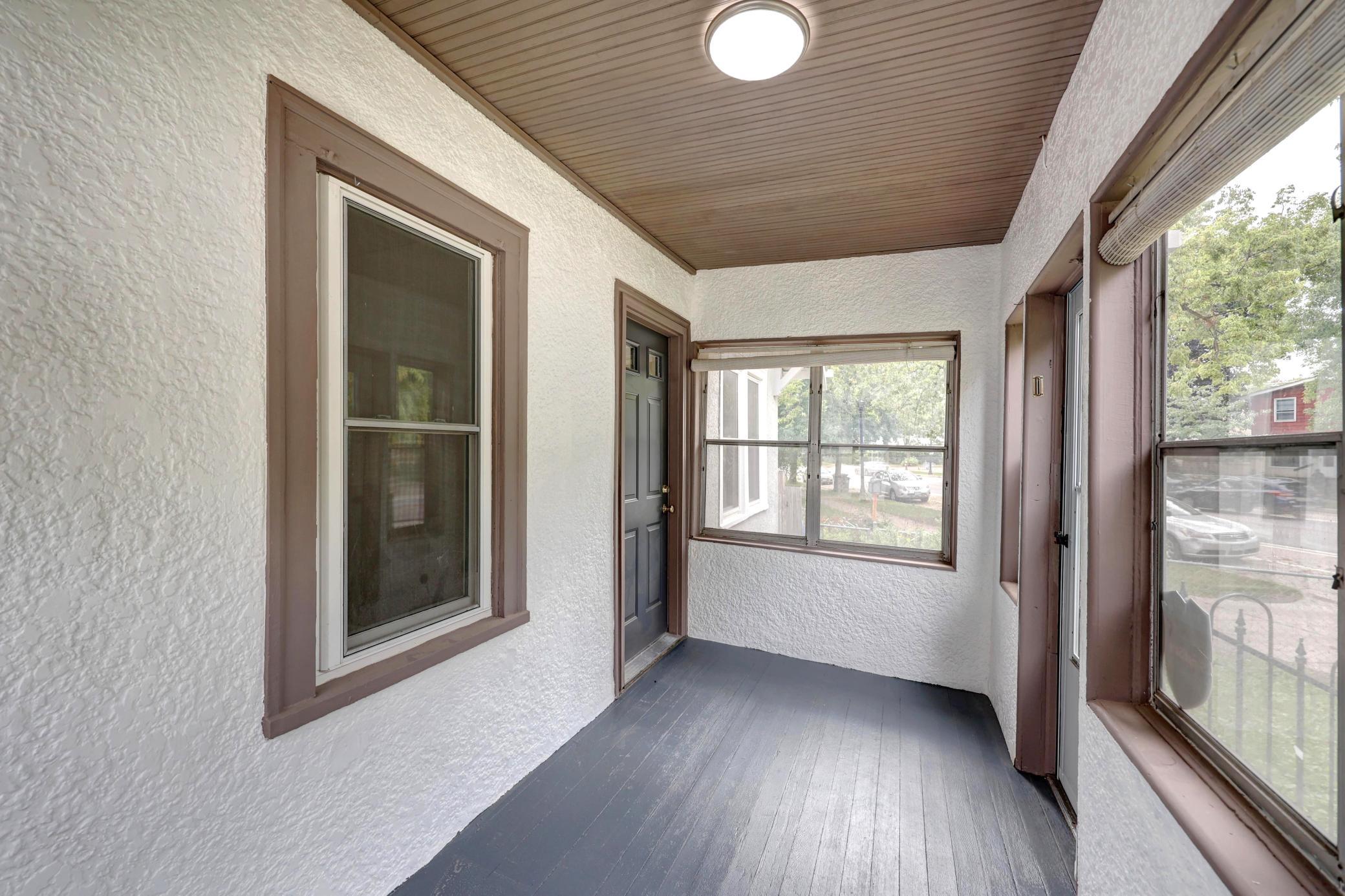 The South Side of the Front Porch. Everyone Loves a Porch! Welcome Guests out of the Weather. Brand New 4 Panel Door with Door Lite Window. The New Door Opens into a Fully Renovated Home!