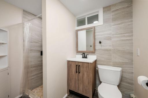 Lower Level has additional 3/4 bath with beautiful tile surround