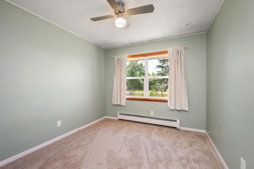 3rd bedroom on main level with ceiling fan and new carpet!