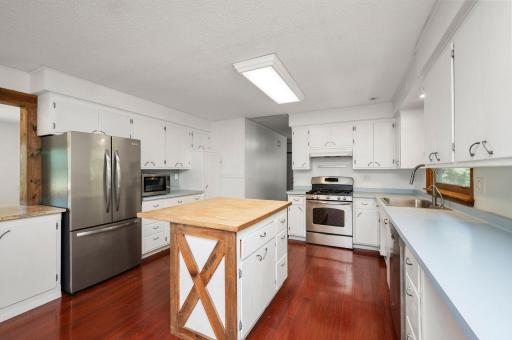 The updated kitchen is a dream, complete with a center island, breakfast bar, and a reverse osmosis system