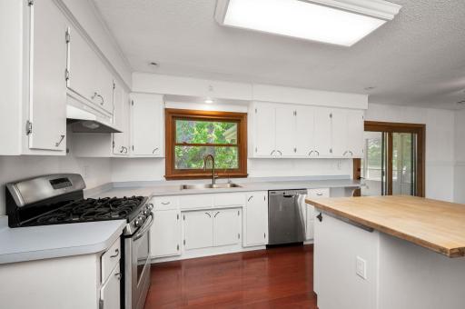The updated kitchen is a dream, complete with a center island, breakfast bar, and a reverse osmosis system