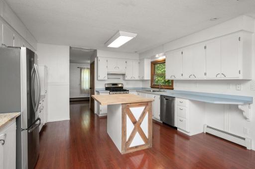The updated kitchen is a dream, complete with a center island, breakfast bar, and a reverse osmosis system