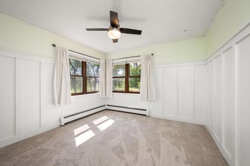 1st bedroom on main level with ceiling fan and new carpet!