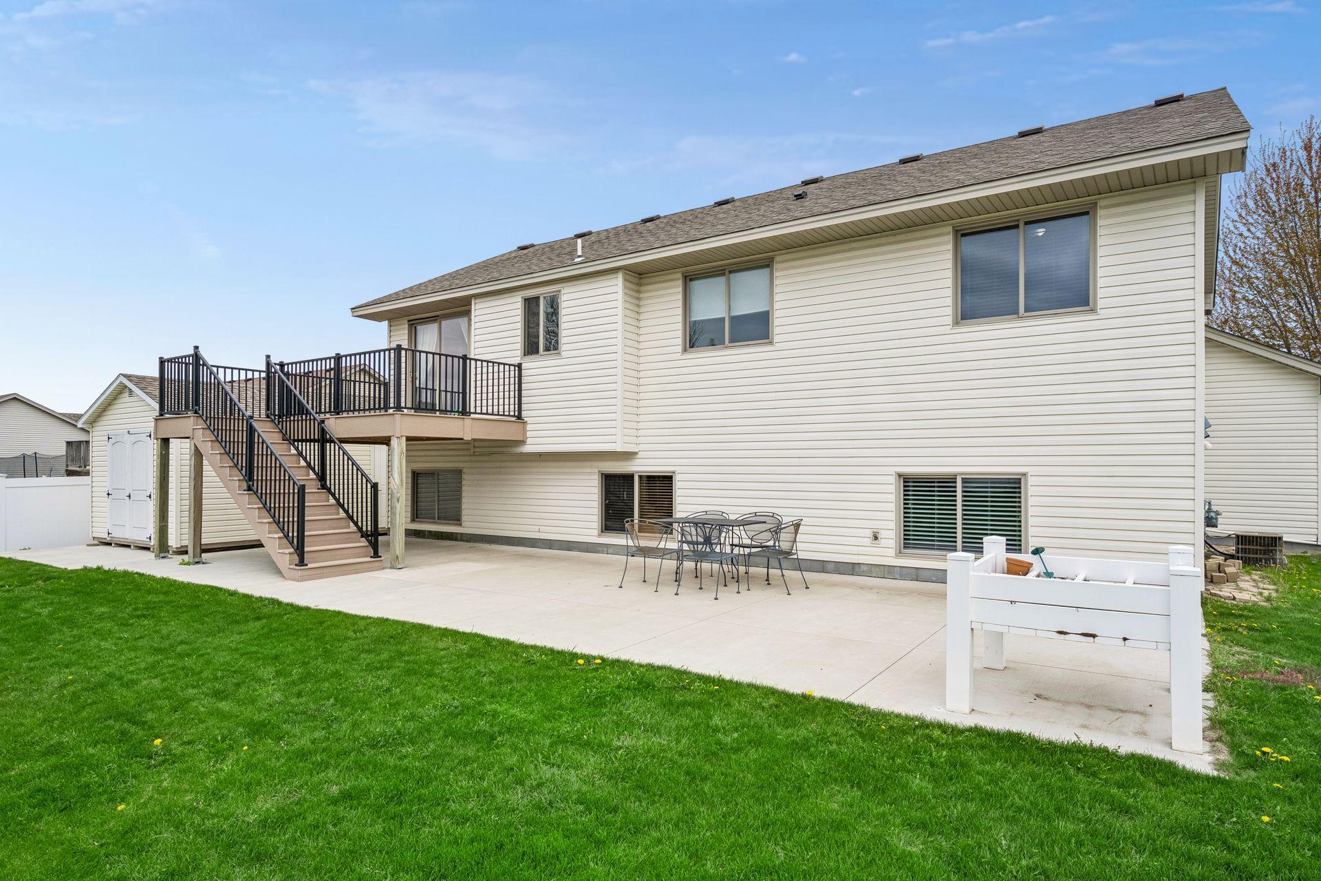 Backyard concrete patio is perfect for BBQ's!