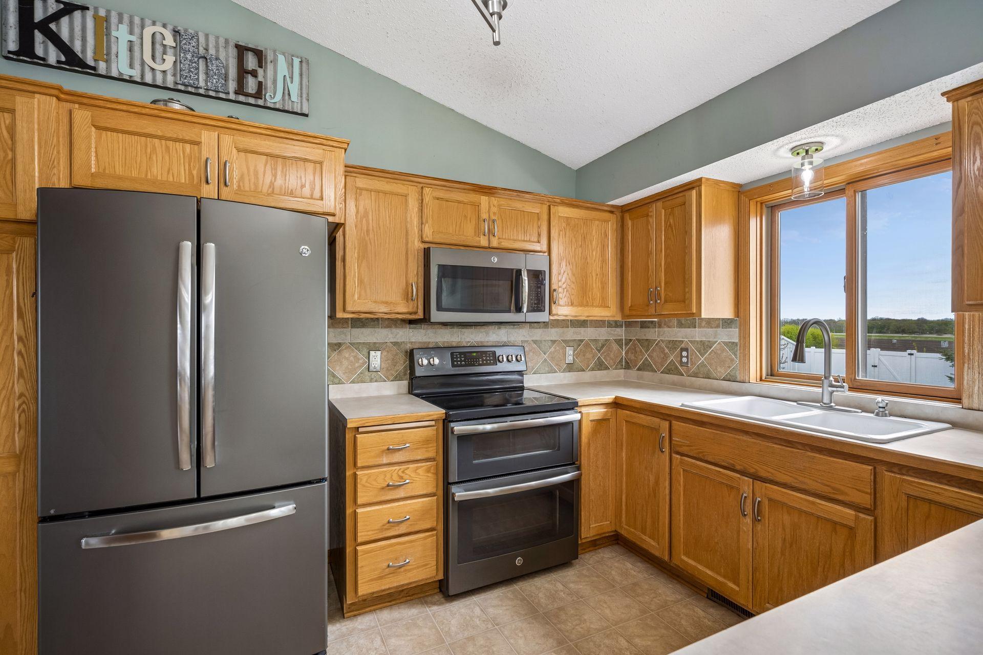 Kitchen has an abundance of cupboards.
