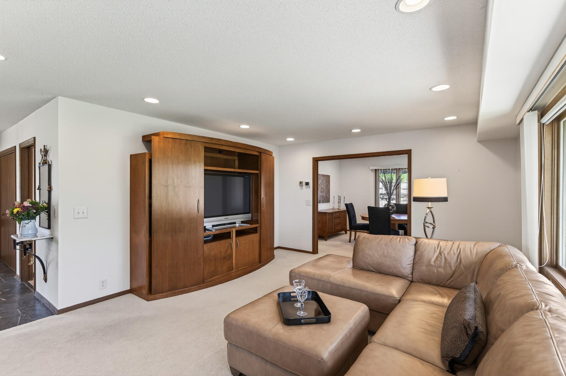 Living room built-in entertainment center was custom built for the owner