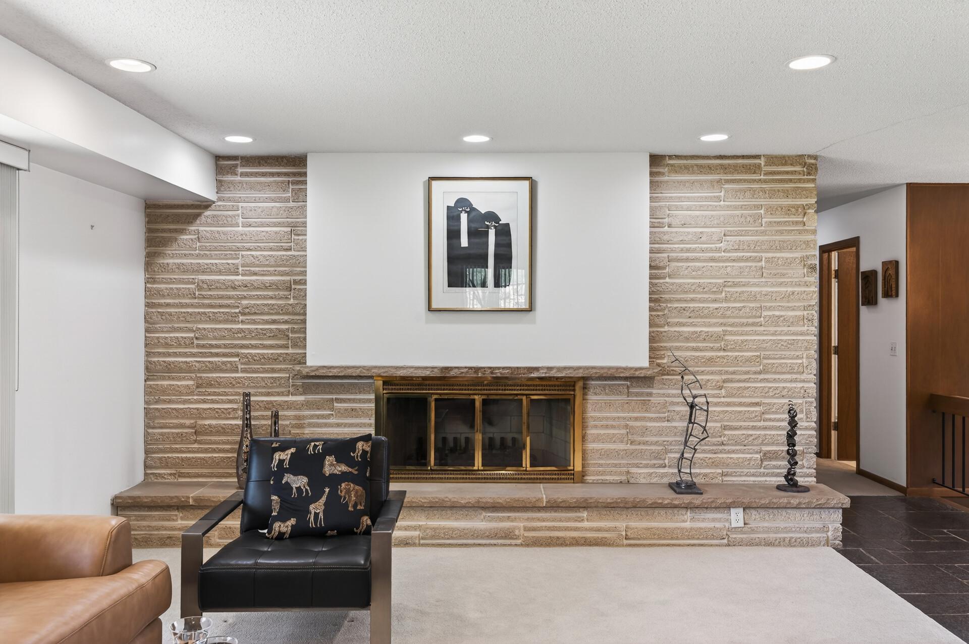 Full wall beveled stone fireplace wall