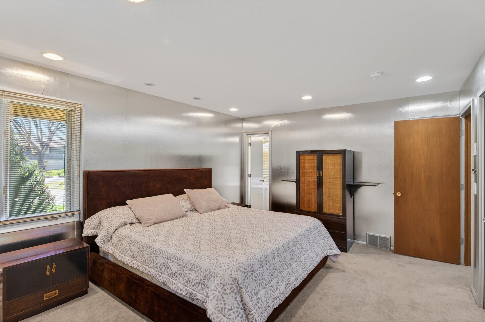 Another built-in chest is tucked behind the bedroom door