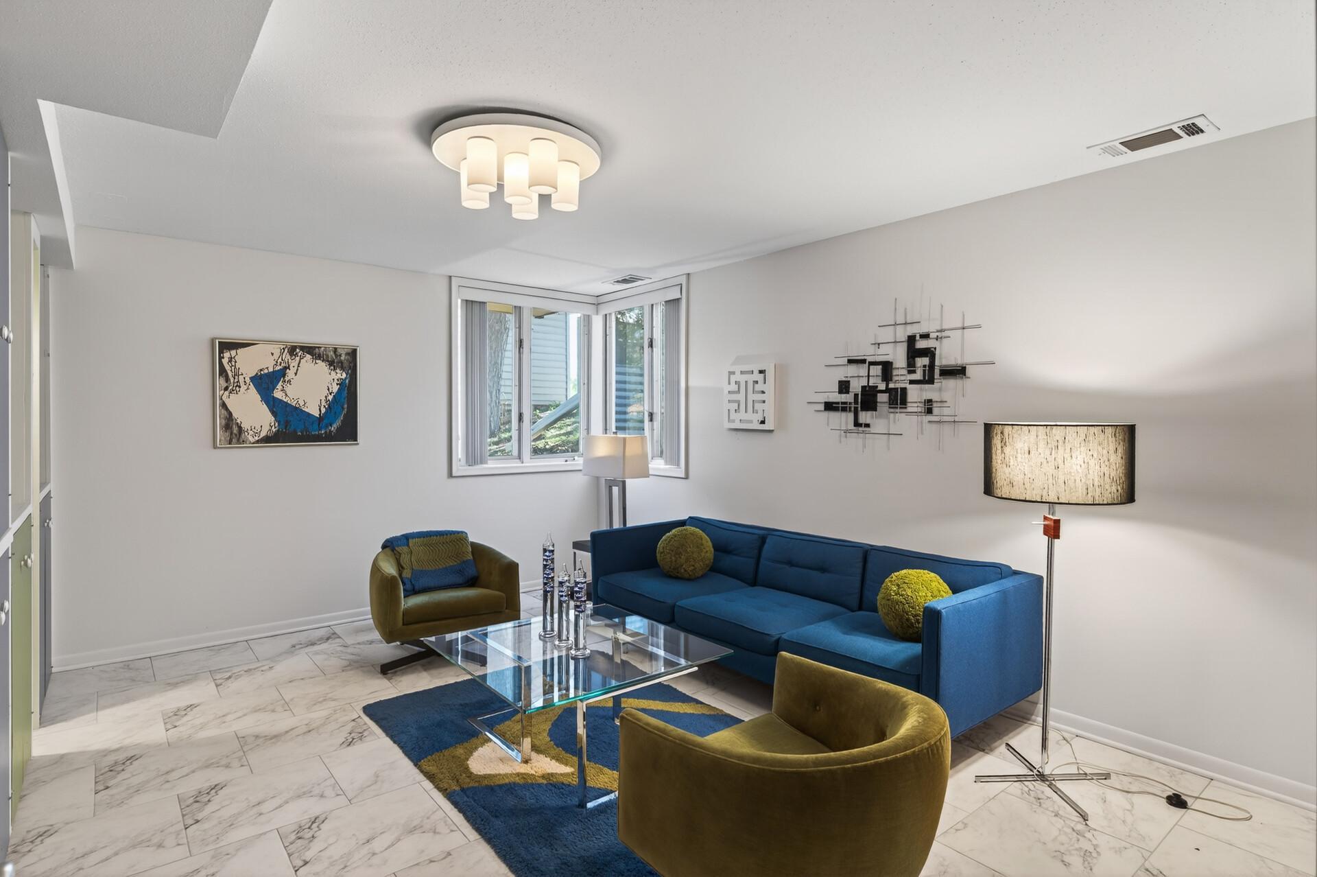 One of the lower level bedrooms currently used as a more intimate social gathering space