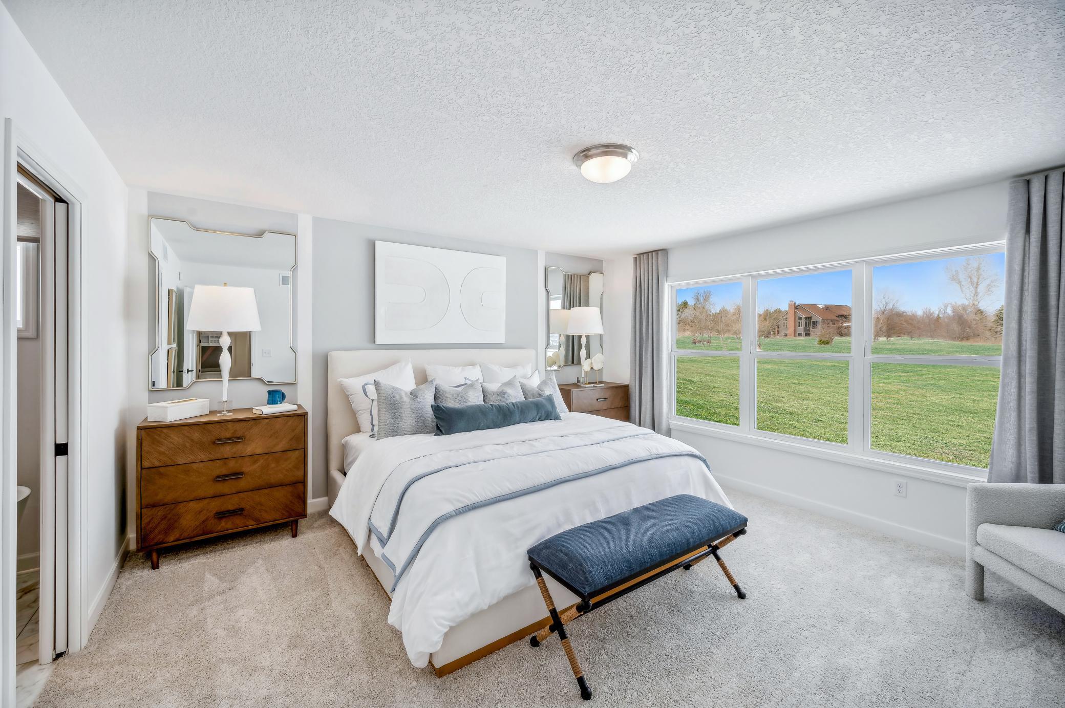 (Photo of a decorated model, actual homes finishes will vary) Find your retreat in the stunning primary bedroom.