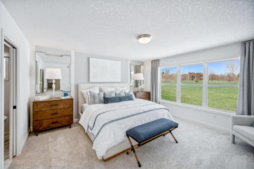 (Photo of a decorated model, actual homes finishes will vary) Find your retreat in the stunning primary bedroom.