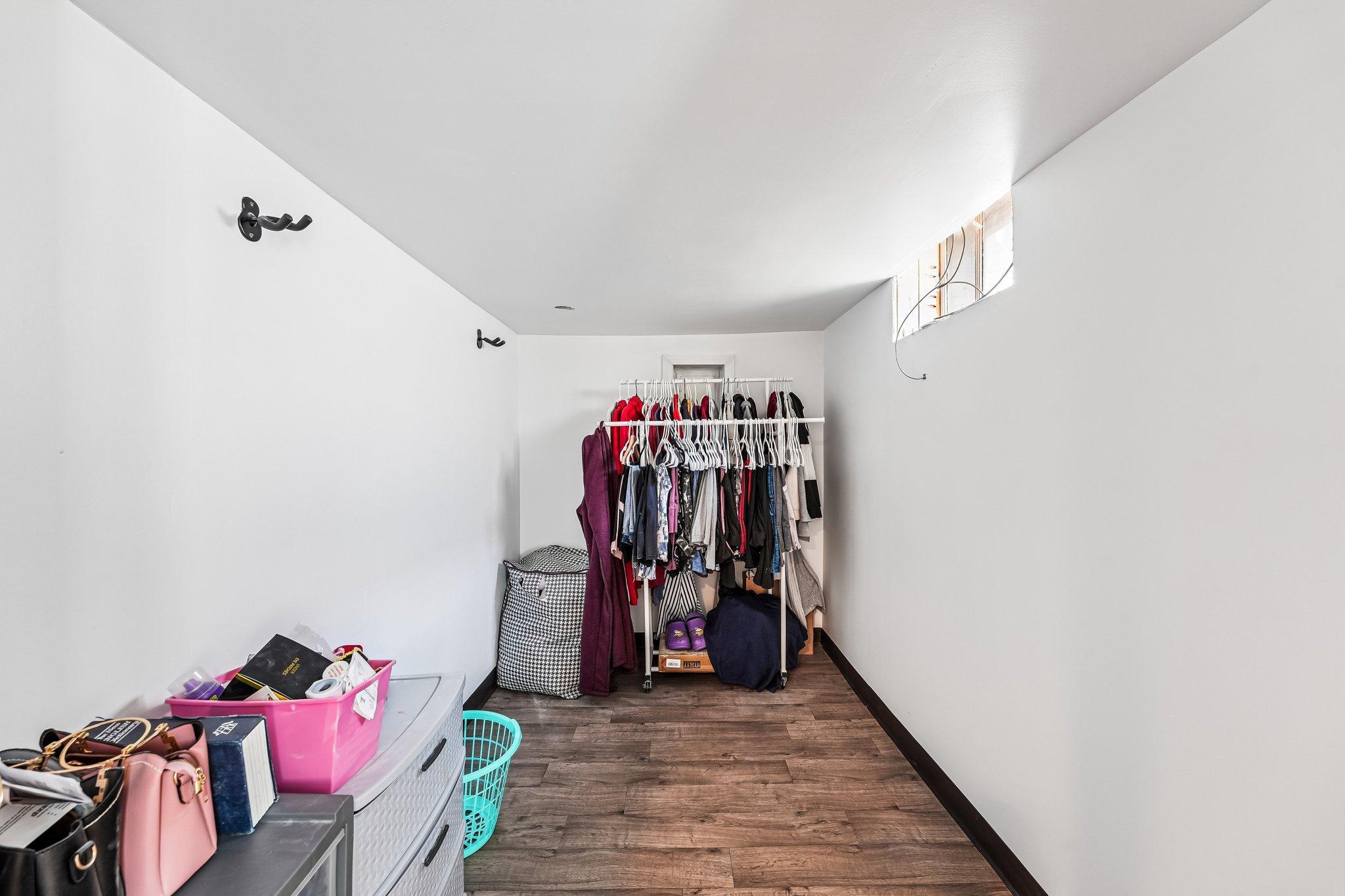 Walk in closet for the basement bedroom