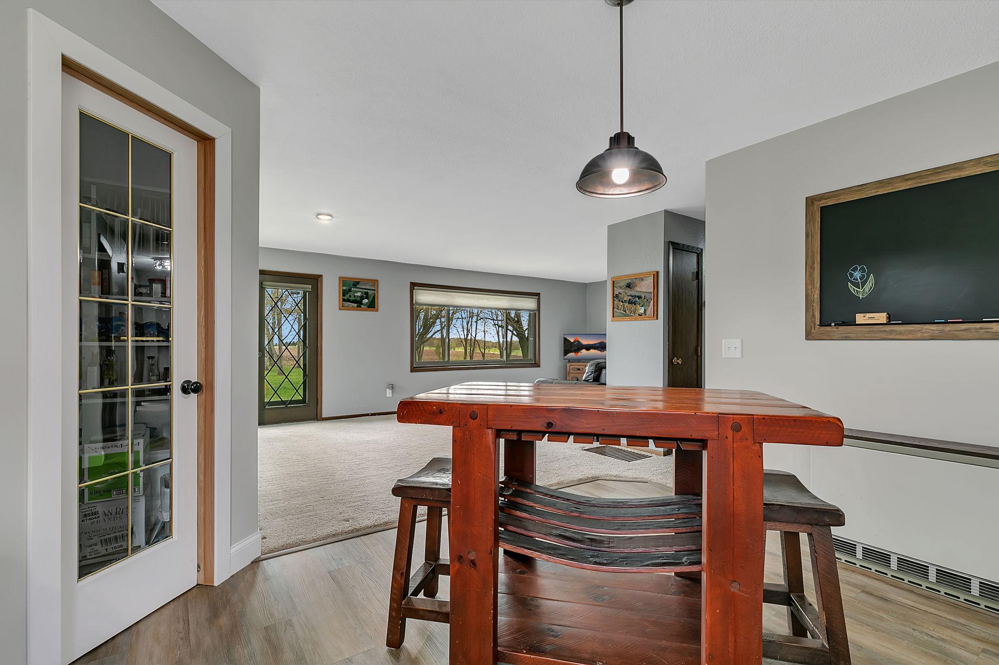 The kitchen and walk-in pantry overlook the spacious living area, which features beautiful views and provides seamless access to the private backyard—making this the ideal space for daily living and entertaining!