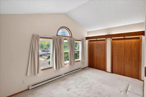 Primary Bedroom with vaulted ceilings.