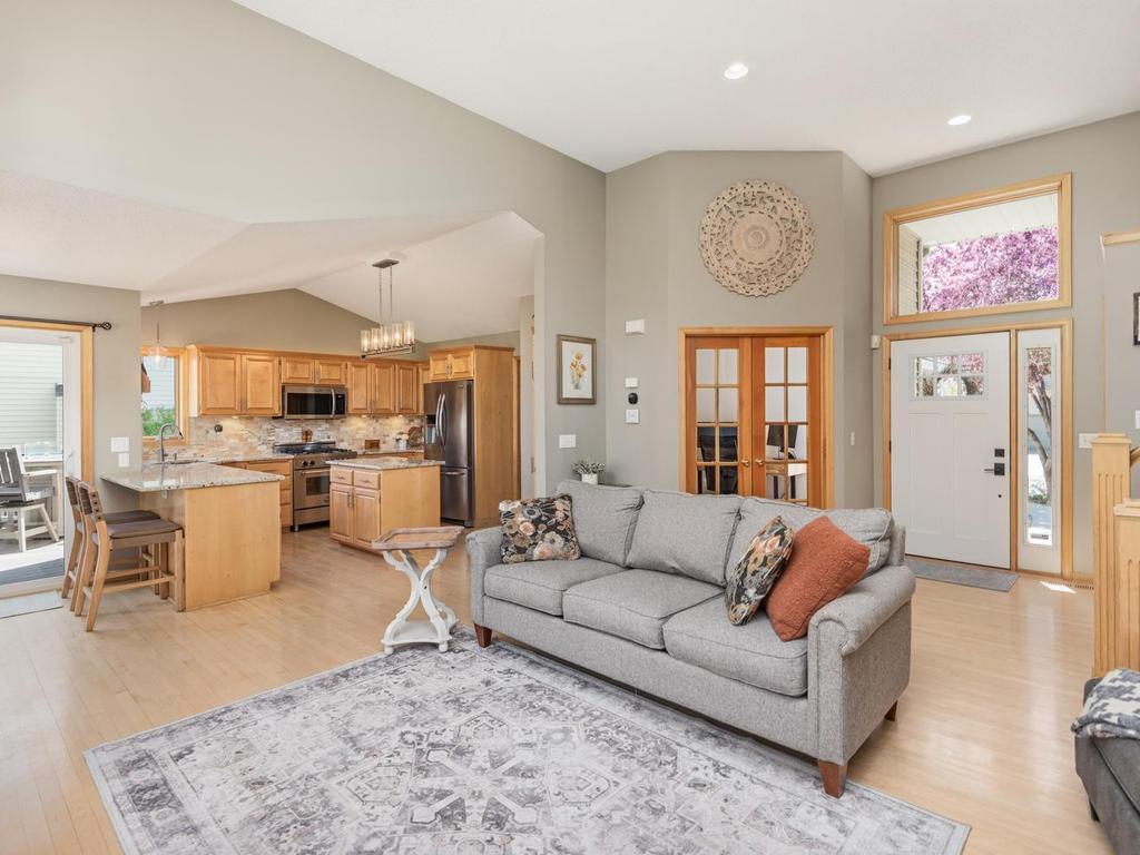 This home showcases stunning natural maple hardwood flooring to enhance the open-concept main-level of your foyer, living room, dining room, kitchen, office and mudroom.