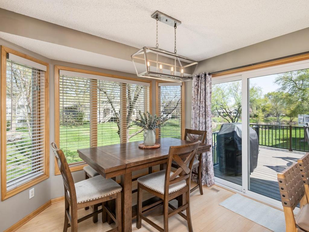 Dining area with sliding glass door that opens to your new maintenance-free deck - easy access for grilling, outdoor entertaining or for your pets to come-and-go.
