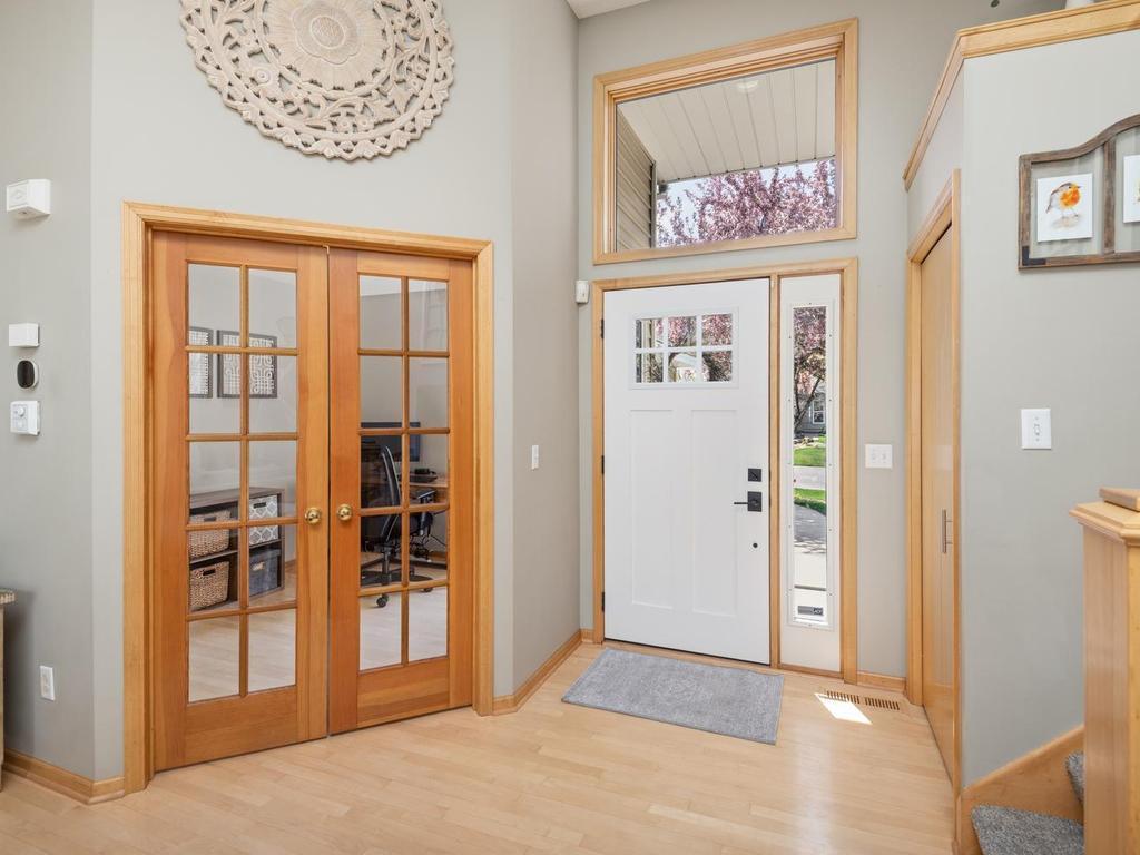 A spacious foyer is inviting. To the left is the home office. To the right is an entryway closet.