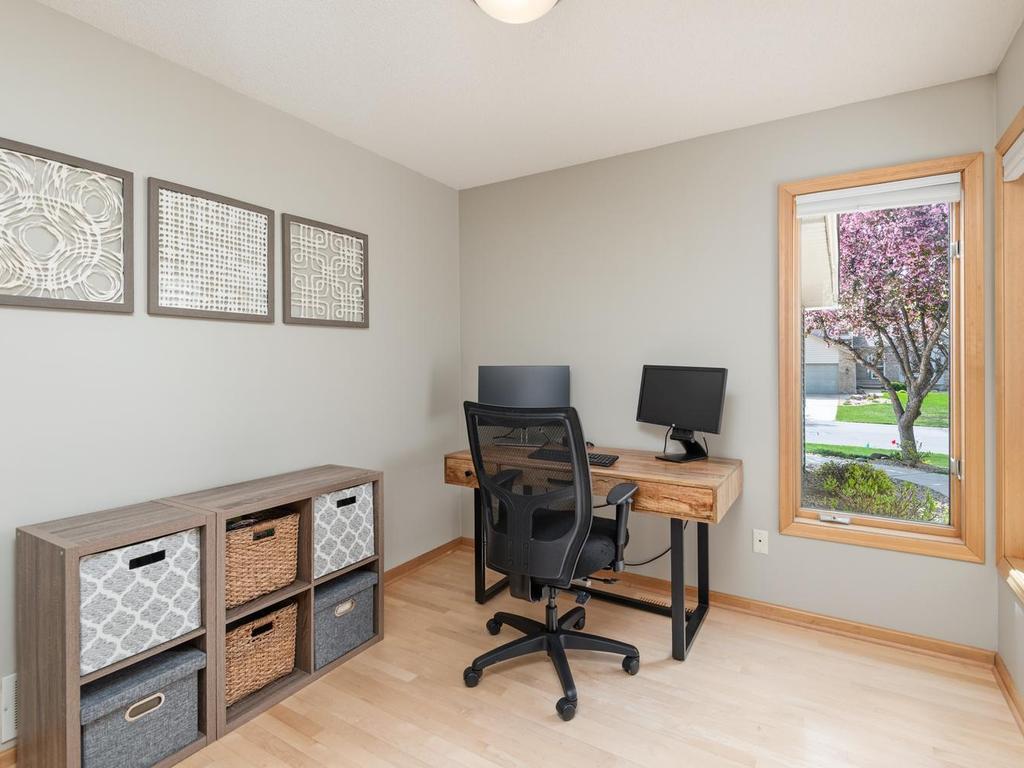 Home office is located off the front foyer, accessible through French doors. 2 front windows allow you views of your yard as well as front door deliveries. Notice the warm neutral tones & maple hardwood flooring that carry throughout the main level.