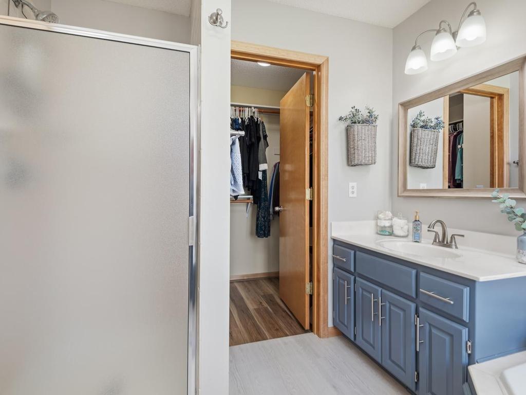 The primary bathroom connects seamlessly to the walk-in closet.