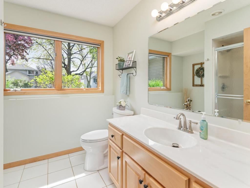 The lower-level ¾ bathroom is conveniently located just steps away from both the bedroom and family room.