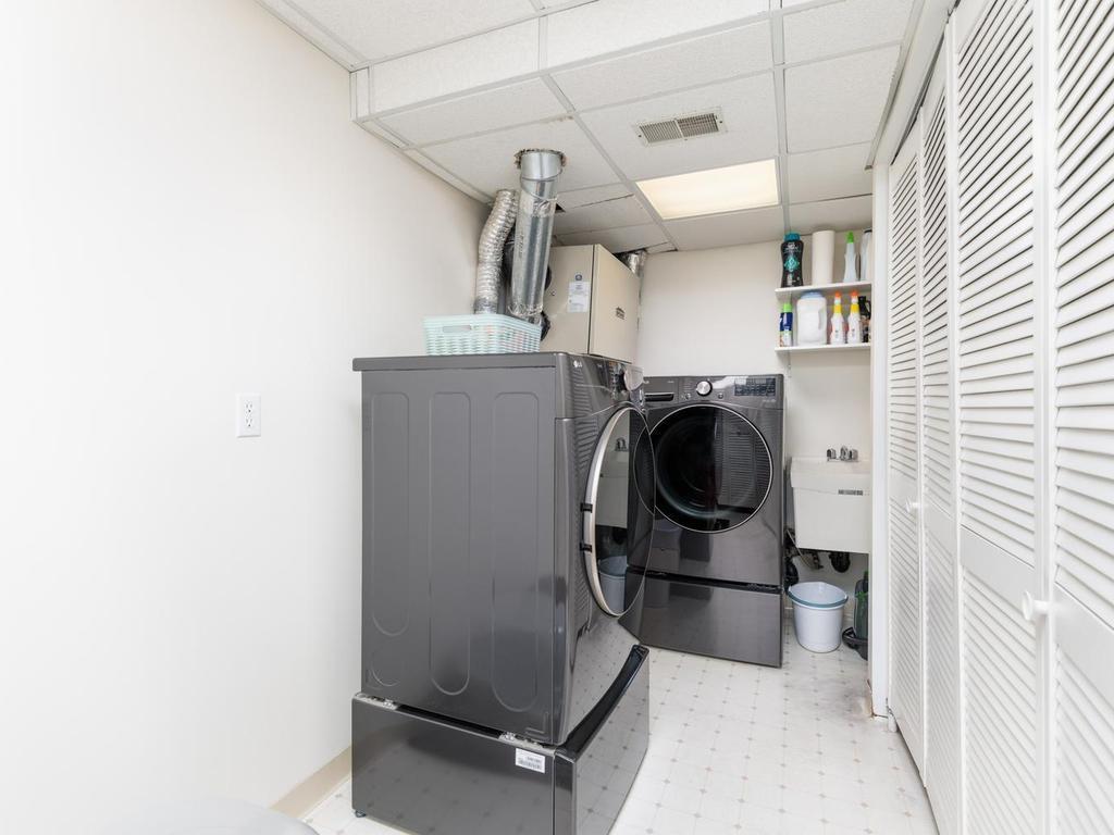 The 14’8” x 8’8” laundry room is on the lower-level w/newer LG washer & gas dryer on pedestals. 5’2” x 5’0” walk-in closet located near the entrance to laundry room. Mechanical room is tucked to the right behind befold doors.