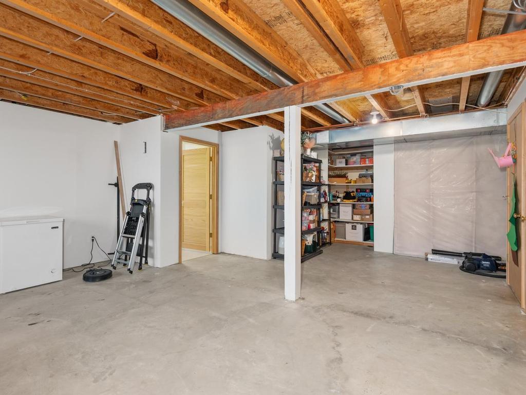 Lower-level offers an expansive unfinished space w/daylight window overlooking backyard — a versatile blank canvas ready for your finishing touch & added equity potential. Whether you envision a man cave, workout rm, workshop...Oh the possibilities!