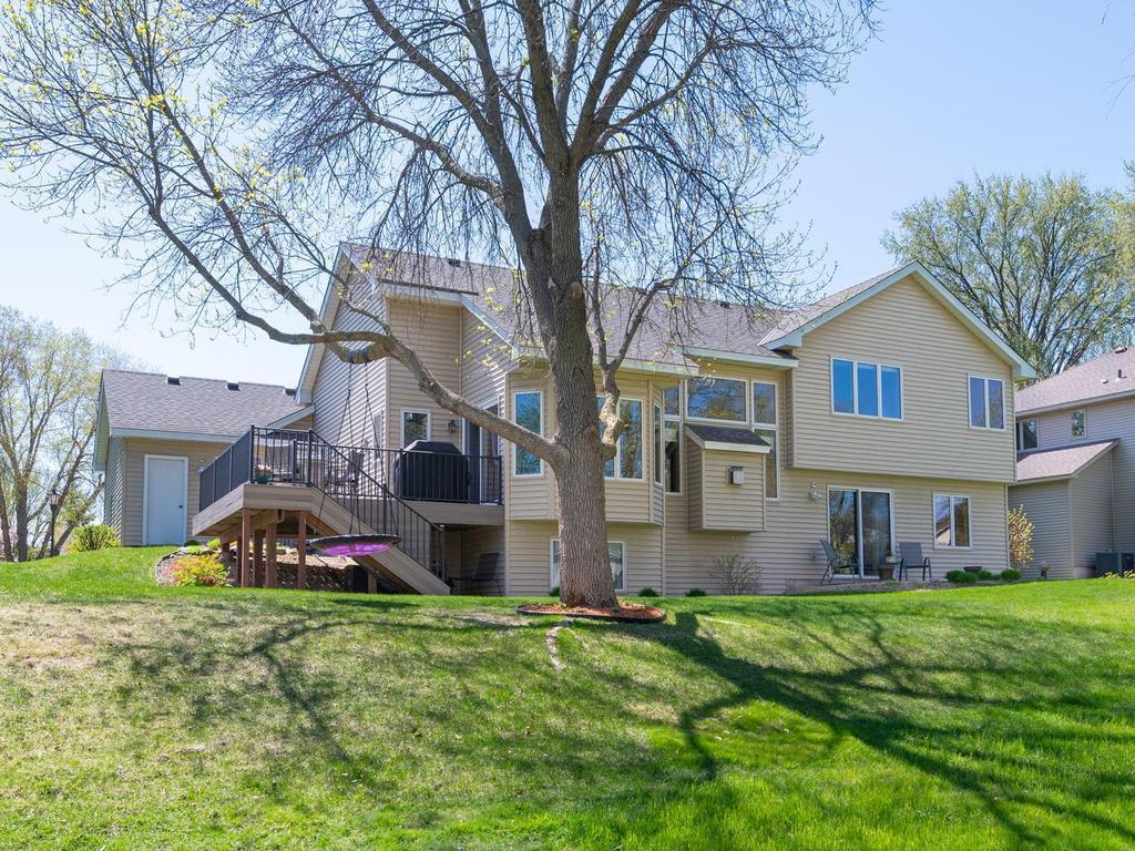 Thoughtfully chosen shrubs and perennial gardens surround the property with color and charm.