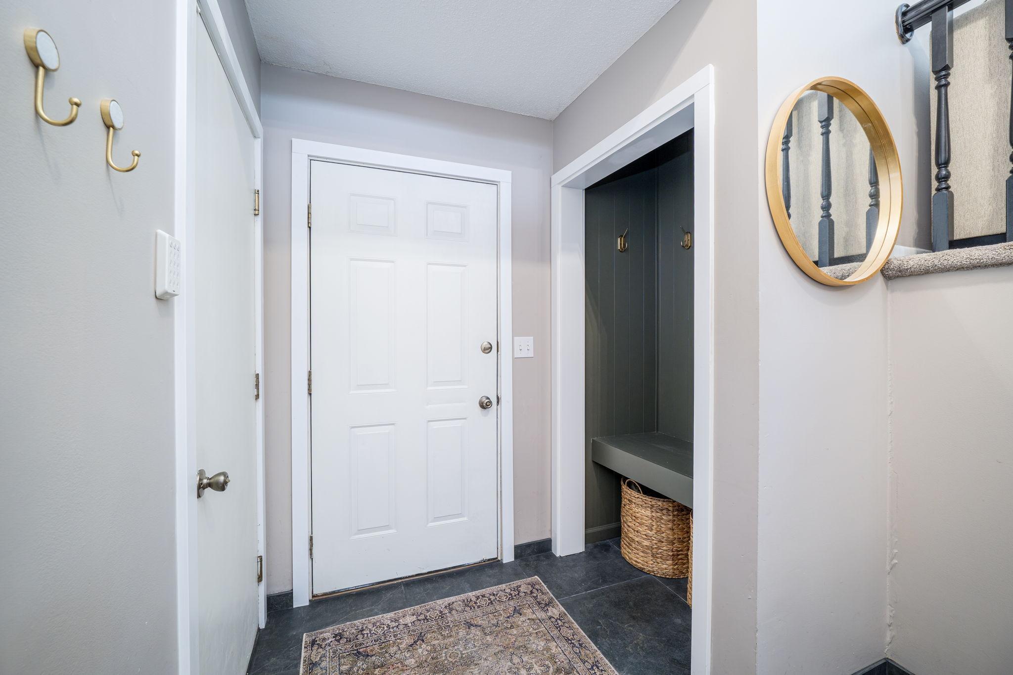 Front Entrance has Garage Access Door and Coat Closet with a Bench for Easy Shoe Removal and Organization!