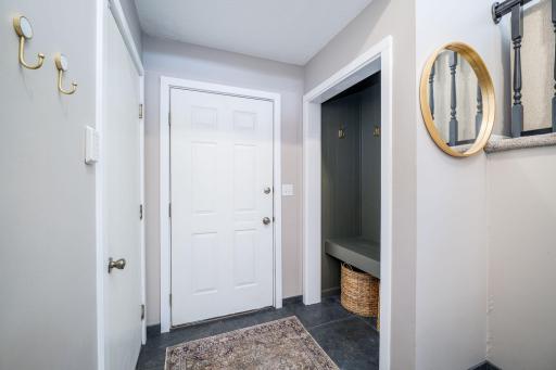 Front Entrance has Garage Access Door and Coat Closet with a Bench for Easy Shoe Removal and Organization!