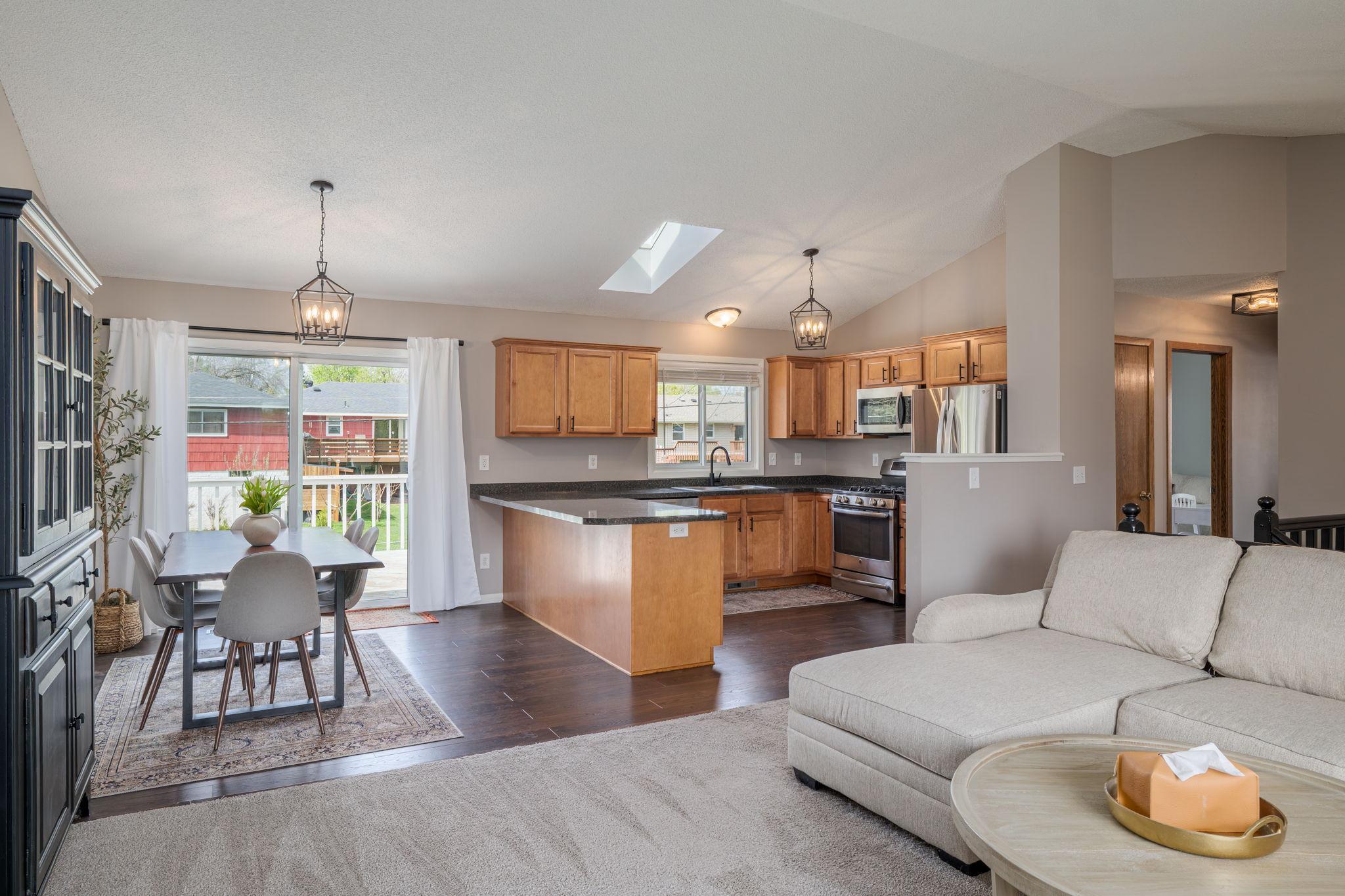 Great Open Concept from Living Room, to Dining Room, Back Deck, and Kitchen!