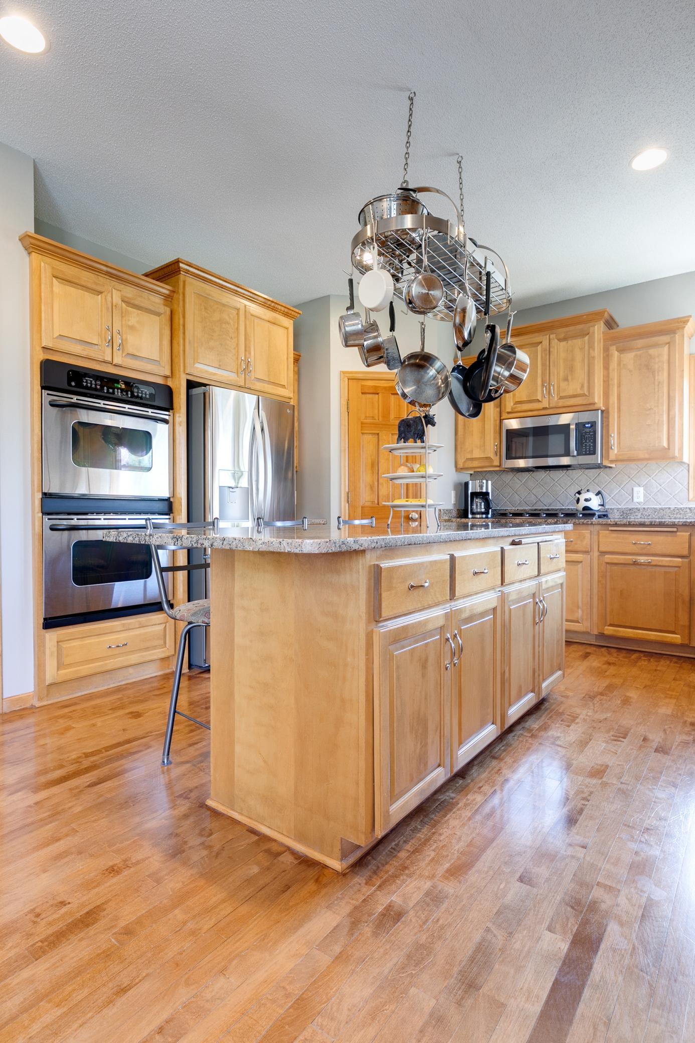 The pot hanging rack will be included with the home.