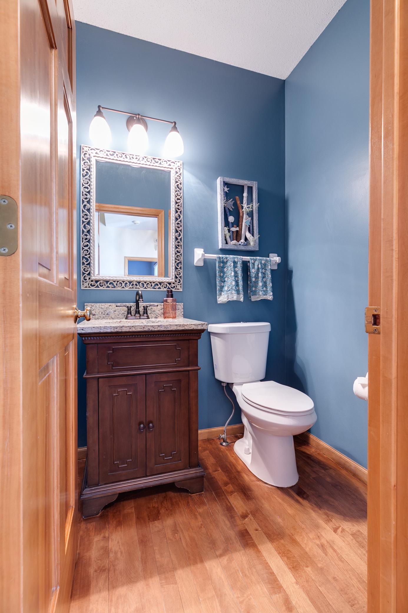 Main floor 1/2 bathroom with newer toilet (2020)
