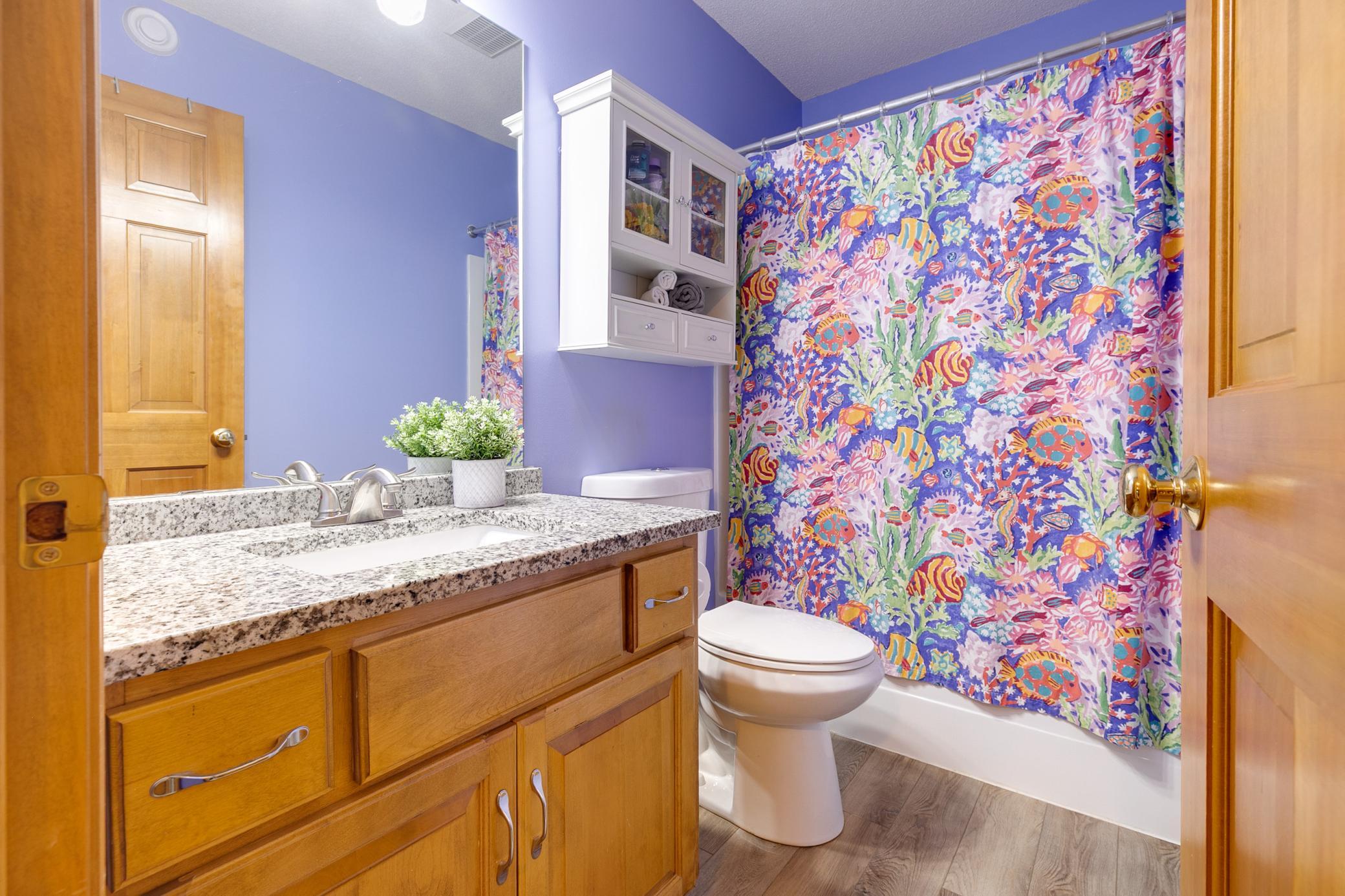 The upper level full bathroom was updated in 2020 with new granite countertops and a new toilet.