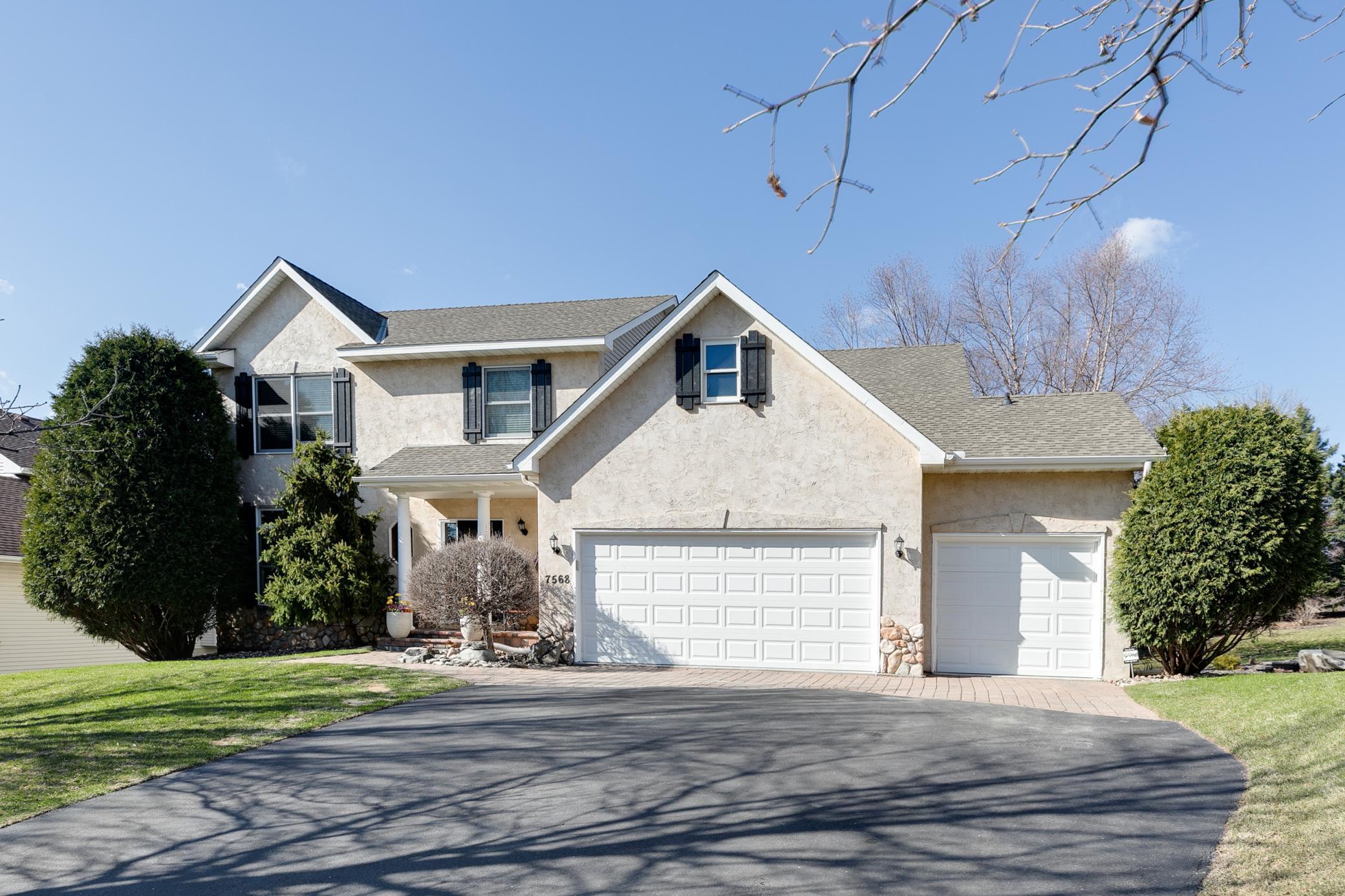 This home features a three-car insulated garage equipped with two garage door openers.