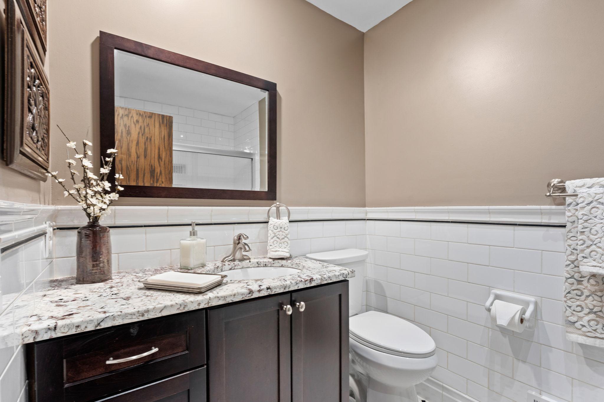 Upper level full bathroom. Updated vanity with granite.