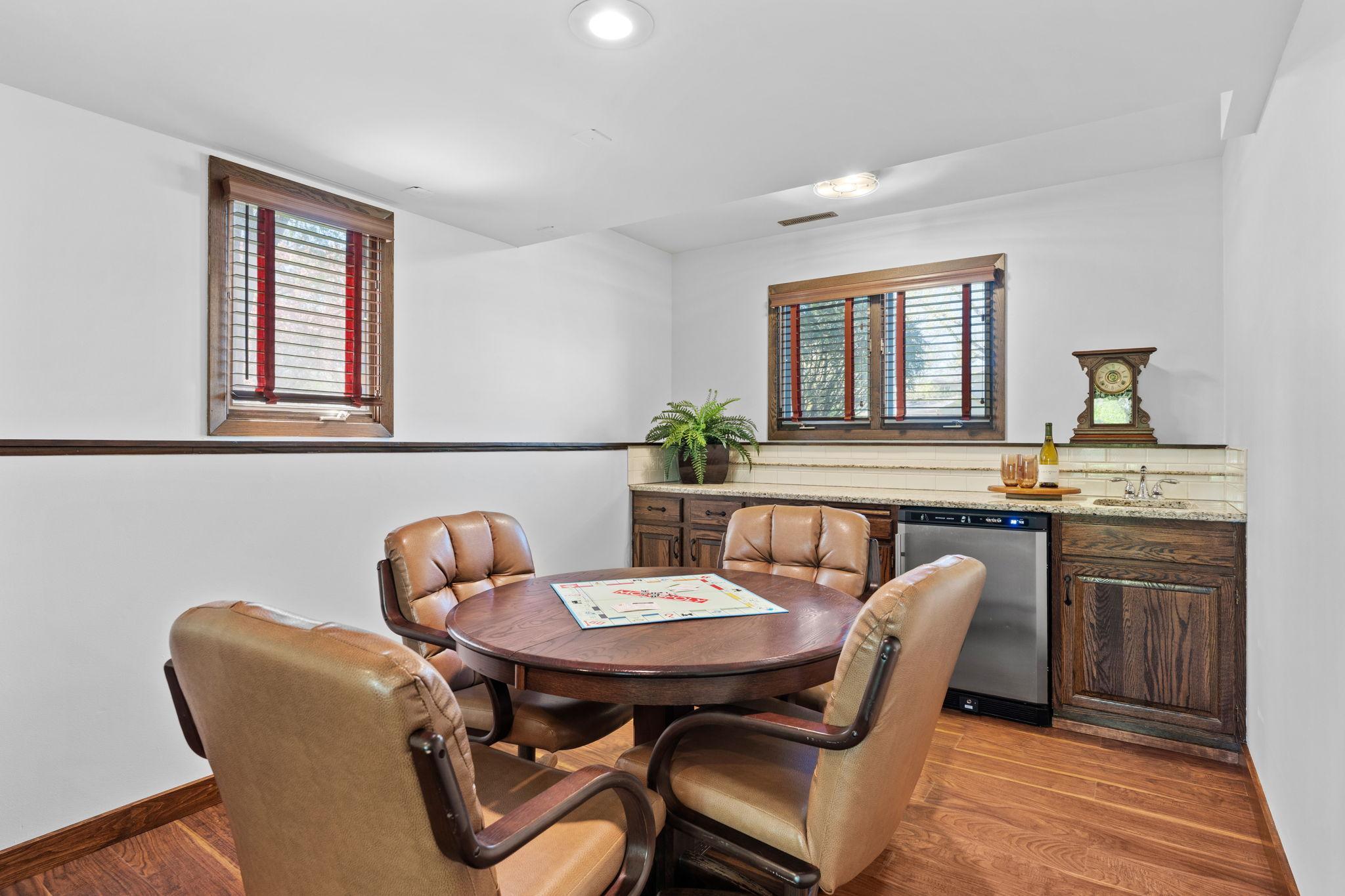 Back inside, you'll find a wet bar and game space. Bar is a great back up serving space for game nights or kid hang outs!